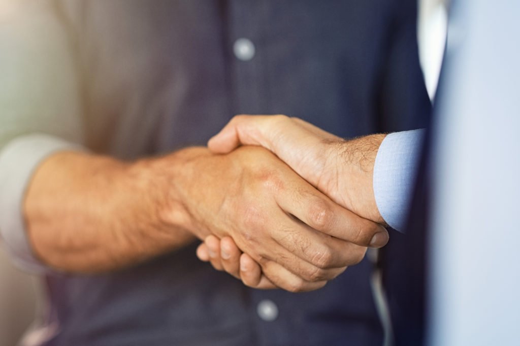 Close up of businessmen shaking hands